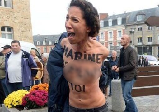 Активістки FEMEN атакували Марін Ле Пен під час першотравневої демонстрації