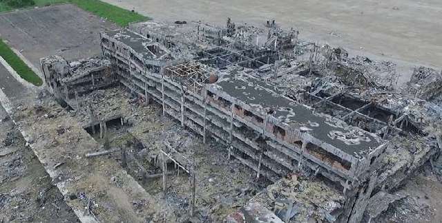 Военные показали, что прячут террористы за зданием донецкого аэропорта (ВИДЕО)