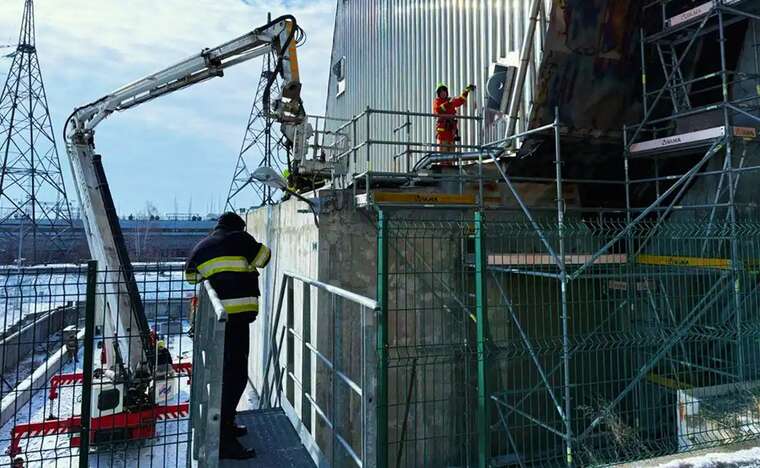 At the Chornobyl Nuclear Power Plant, rescuers continue to extinguish the smoldering area