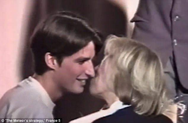Footage captures the moment a 15-year-old Emmanuel Macron (left) kissed his 40-year-old teacher (right) - two years before he declared he wanted to marry her dqxikeidqxiqqeant