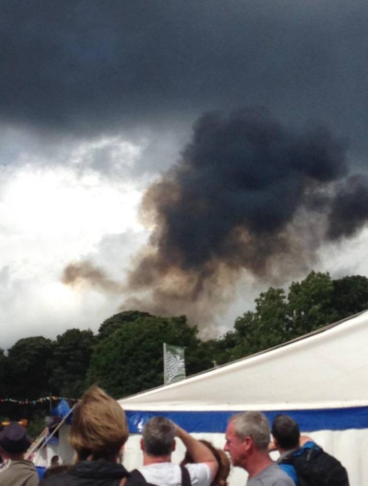 PIC FROM CATERS NEWS - A stunt plane has crashed during an aerobatics show at a car festival in Cheshire. There is currently no confirmation of any injuries or the type of plane involved, although it was reported to be of a similar design to those used by the Red Arrows. Police have confirmed that they are attending the incident. dqxikeidqxiqqeant