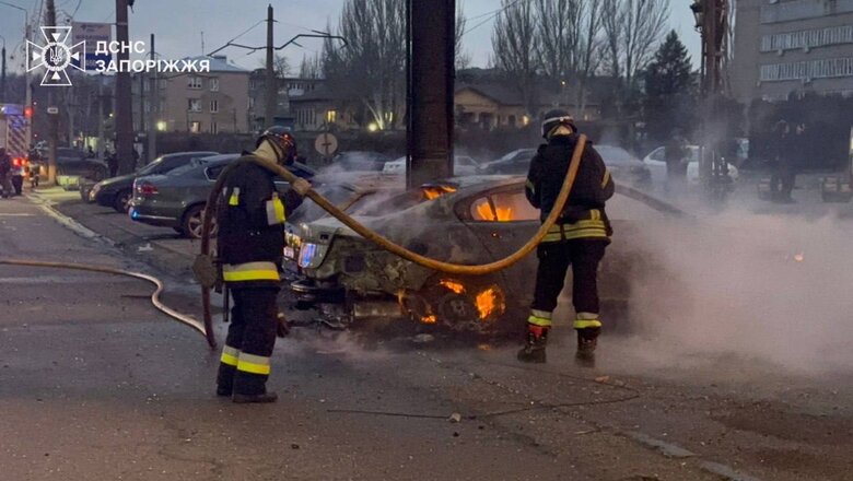 Rescuers at the site of the Russian strike on Zaporizhzhia